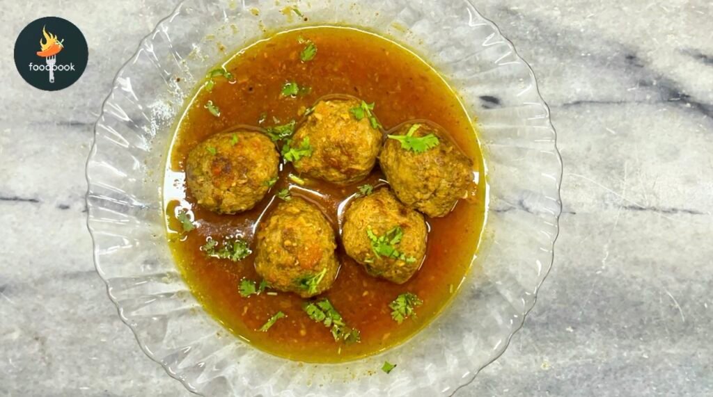 Beef Kofta Handi served in a traditional clay pot with naan